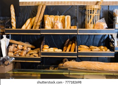 bakery shop with assortment of bread on shelves - Shutterstock ID 777182698