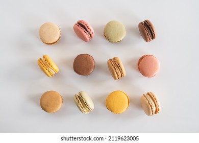 Bakery Still Life. Pastel Macarons. Multi Colored Macaron Flat Lay on White Background.