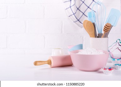 Bakery utensils. Kitchen tools for baking on a white wooden background.
