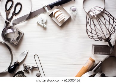 Bakery Utensils. Kitchen Tools For Baking On A White Wooden Background. Free Space For Text . Top View