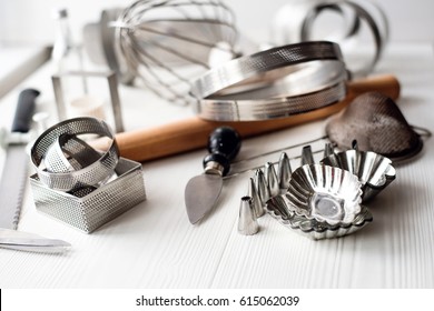 Bakery Utensils. Kitchen Tools For Baking On A White Wooden Background.