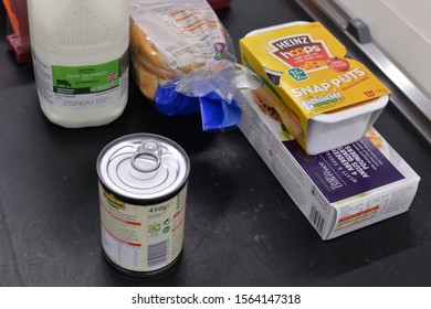 BAKEWELL, UNITED KINGDOM, 18th November, 2019: Assorted Grocery Shopping On A Supermarket Conveyor Belt At Checkout