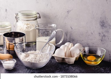 Baking Background. Cooking Ingredients For Dough, Eggs, Flour, Sugar, Milk.