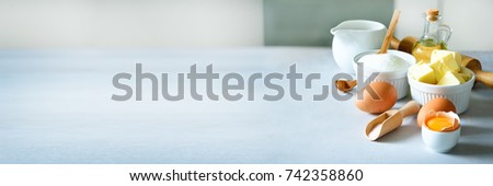 Baking background. Cooking ingredients for dough, eggs, flour, sugar, butter, rolling pin on white style kitchen. Copy space. Banner