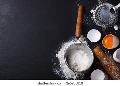 Baking background with eggshell,  flour and rolling pin .selective focus..Copy space.