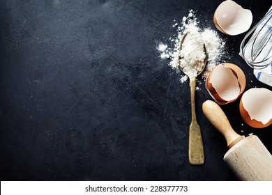 baking background with eggshell and rolling pin