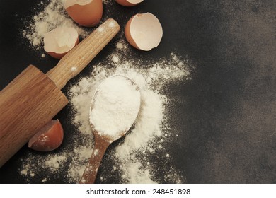 Baking background with eggshell and rolling pin