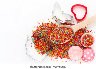 Baking background with ingredients: colorful sugar sprinkling, cutter for cookies, mold for cake isolated on white background empty space for text top view - Powered by Shutterstock