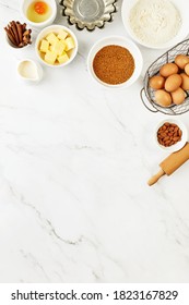Baking Background With Ingredients Standing On A Marble Table Surface, Top Down View, Blank Space For A Text