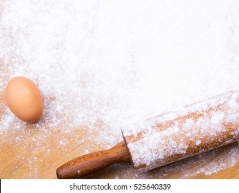 baking background with pastry board, rolling pin and egg