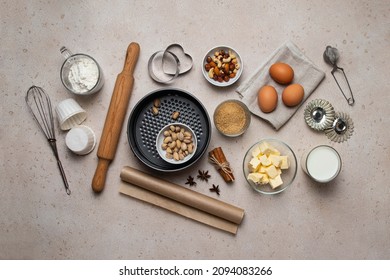 Baking background. Baking tools and food ingredients for baking - flour, eggs, sugar, milk, nuts on beige background. Baking or cooking cakes or muffins. Copy space, top view. - Powered by Shutterstock