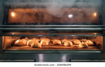 Baking Bread Inside An Oven In A Bakery