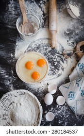 Baking Cake Or Cupcakes Ingredients - Bowl, Flour, Eggs, Egg Whites Foam And Eggshells On Black Chalkboard From Above. Cooking Course Or Kitchen Mess Poster Concept.