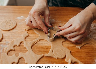 Baking christmas cookies on brown wooden table - Shutterstock ID 1212134566