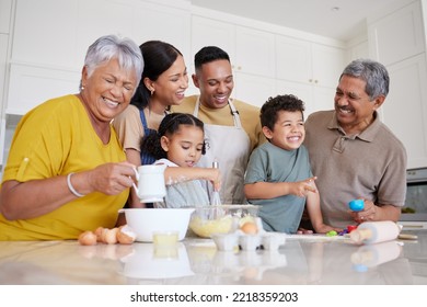 Baking, comic and big family in the kitchen for food, cooking and happy together in their house. Funny children with parents and grandparents learning to make cookies, cake or lunch with smile - Powered by Shutterstock