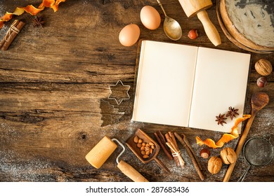 Baking Concept Background With Cookbook, Ingredients And Utensils For Christmas Cookies