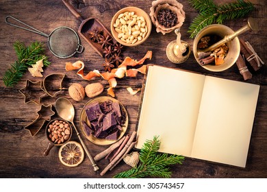 Baking Concept Background With Cookbook, Spices And Utensils For Christmas Cookies