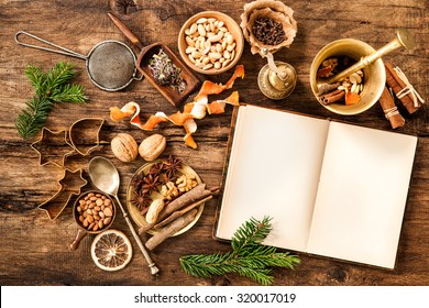 Baking Concept Background With Cookbook, Spices And Utensils For Christmas Cookies