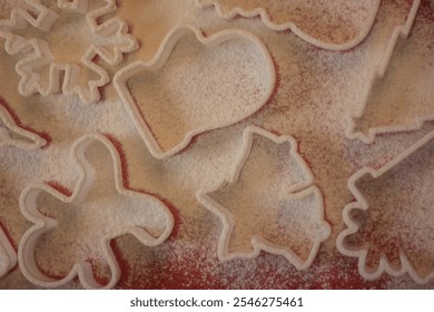 Baking concept for Christmas. cookie shapes: home, snow flakes, gingerbread man, bells, Christmas tree, present and snow man. - Powered by Shutterstock