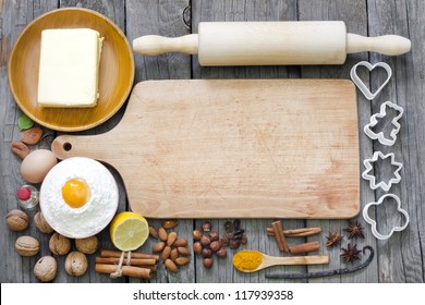 Baking cookies with spices and empty cutting board abstract background - Powered by Shutterstock