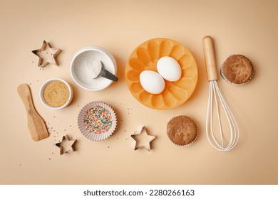 Baking or cooking colorful background. Ingredients, kitchen items for baking. Kitchen utensils, flour, eggs, sugar and muffins. Text space, top view. - Powered by Shutterstock