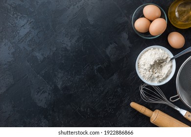 Baking cooking Ingredients on black background. Top view. Frame copy space. - Powered by Shutterstock