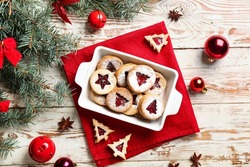 Baking Dish With Tasty Linzer Cookies And Christmas Decor On White Wooden Background
