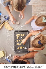 Baking, Family And Girl Children Learning To Bake Cookies In Kitchen At Home From Above With Mom, Dad And Sister. Man, Woman And Kids Having Fun With Dough, Cooking And Food Together Making Pastry