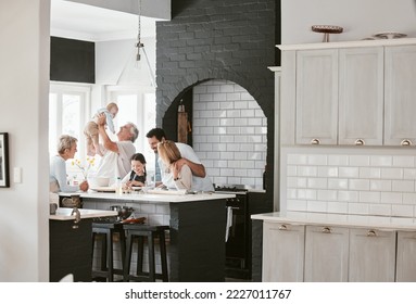 Baking, happy and big family bonding in kitchen for food with conversation in a house. Cooking, communication and children with parents and grandparents for breakfast, lunch or dinner in family home - Powered by Shutterstock