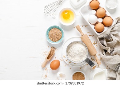 Baking Homemade Bread On White Kitchen Worktop With Ingredients For Cooking, Culinary Background, Copy Space, Overhead View