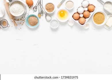 Baking Homemade Bread On White Kitchen Worktop With Ingredients For Cooking, Culinary Background, Copy Space, Overhead View