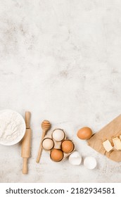 Baking Homemade Cookies On Gray Kitchen Worktop With Ingredients -flour, Eggs,  Sugar And  Cinnamon. Culinary Background, Copy Space, Overhead View