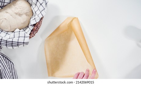 Baking homemade sourdough wheat bread in cast iron dutch oven. - Shutterstock ID 2142069015
