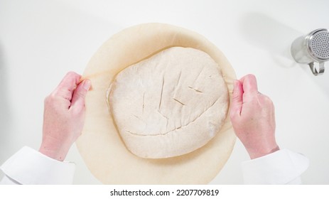 Baking Homemade Sourdough Wheat Bread In Cast Iron Dutch Oven.