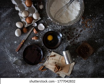 Baking Ingredients Flatlay With Copy Space. Cooking Ingredients On Black Table.