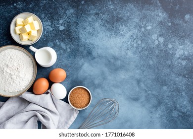 Baking ingredients flour eggs sugar milk and butter on a painted blue background. Top view copy space. Baking concept - Powered by Shutterstock