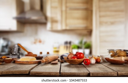 Baking ingredients placed on wooden table, ready for cooking. Copyspace for text. Concept of food preparation, kitchen on background.