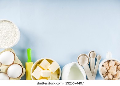 Baking Ingredients And Tools On Trendy Bright Blue Background - Flour, Eggs, Sugar, Milk, Butter, Layout, Flatlay Top View Copy Space