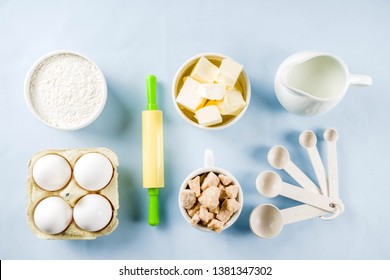 Baking Ingredients And Tools On Trendy Bright Blue Background - Flour, Eggs, Sugar, Milk, Butter, Layout, Flatlay Top View Copy Space