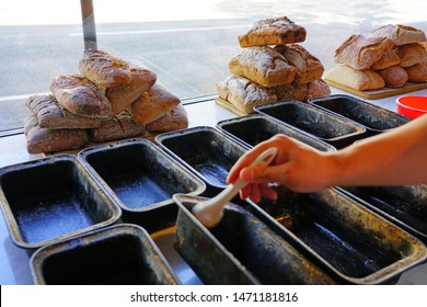 Baking Irish Brown Soda Bread Loafs In Cake Pans In A Bakery