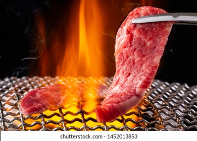 Baking meat at a yakiniku restaurant
