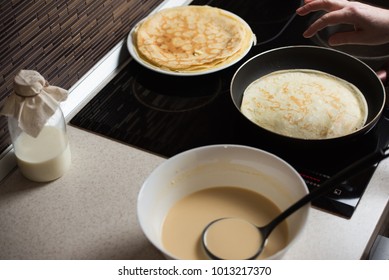 Baking Pancakes In Modern Kitchen. Steps Of Making Cooking Pancake.