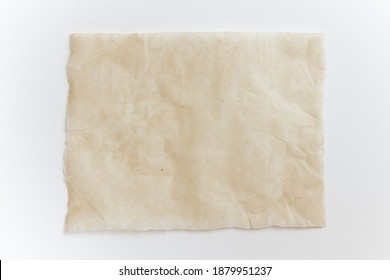 Baking Paper Sheet Isolated On White Background, Top View. Parchment For Baking Culinary.