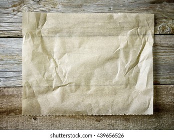 Baking Paper Sheet On Wooden Table, Top View