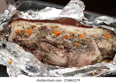 Baking Of Pork Shoulder In The Foil At Oven