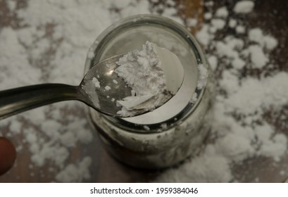 Baking Powder In Spoon On Wood. Taken Out Of A Jar, Or It Can Be Baking Soda