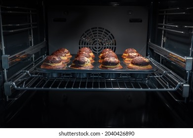 Baking process of chocolate muffins in oven, home made. Sweet cupcakes with cocoa baked in oven. - Powered by Shutterstock