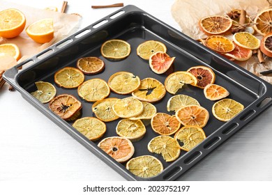 Baking Sheet With Dried Orange Slices On Light Background