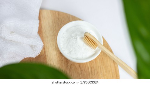 Baking Soda And A Clean, Fresh White Towel. Natural Wooden Toothbrush.on A Wooden Stand. The Concept Of Alternative Environmentally Friendly Home Care For The Oral Cavity.