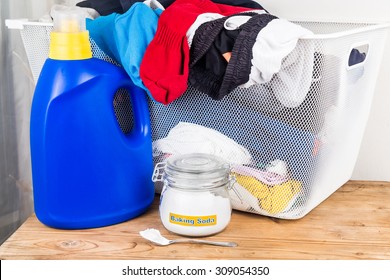 Baking Soda With Detergent And Pile Of Dirty Laundry